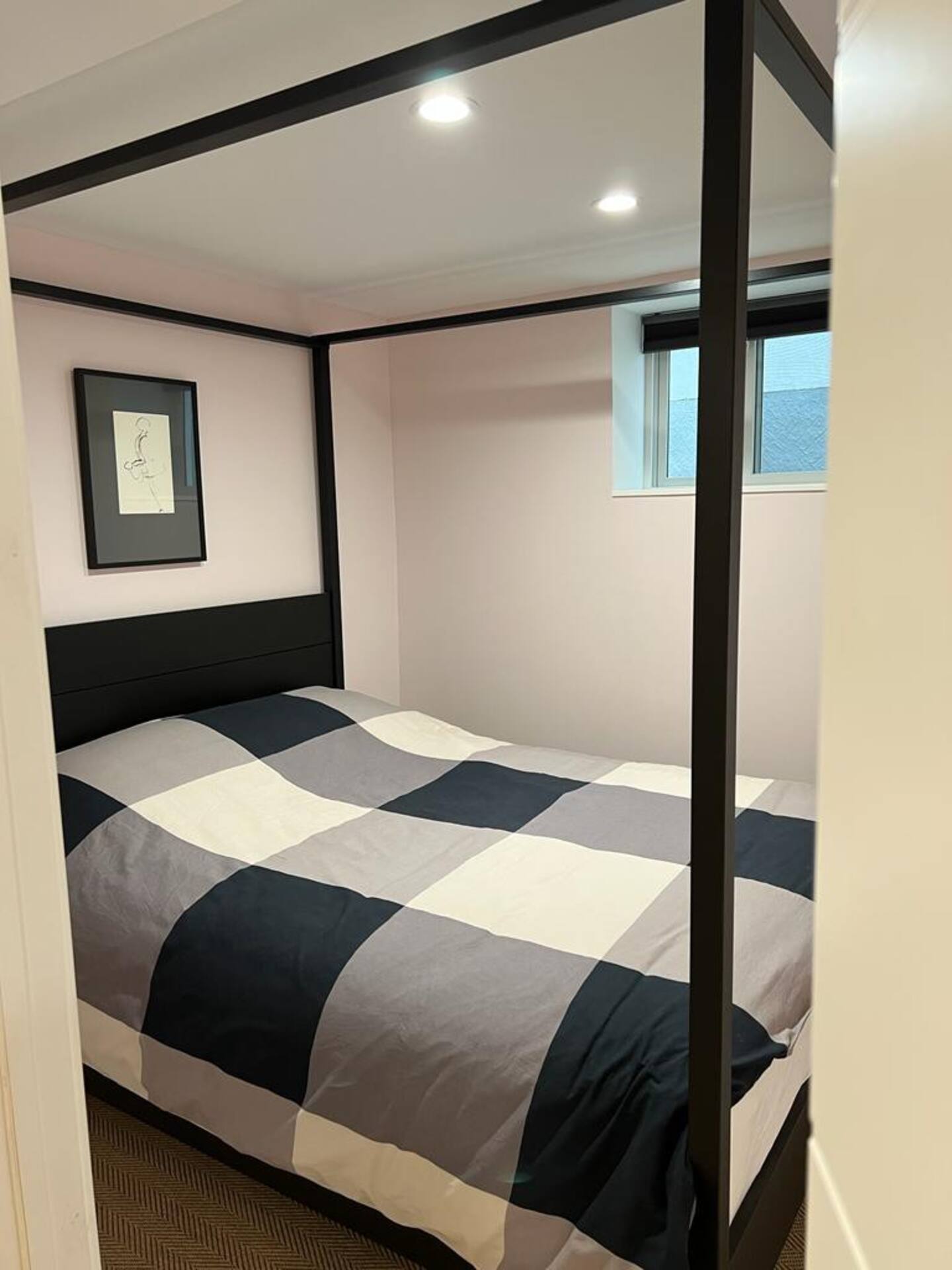 Cozy bedroom with four-poster bed